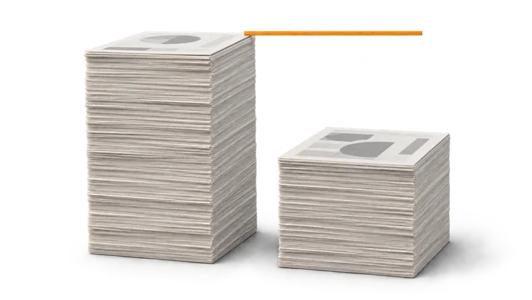 Two stacks of paper side by side, one shorter, with a bar marking the height the short one never reached